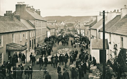 Fair day at Glenties, County Donegal, about 1900: a wide street lined with people and carts.